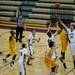 Dexter and Ypsilanti High School basketball players reach for a rebound on Friday, Feb. 15. Daniel Brenner I AnnArbor.com